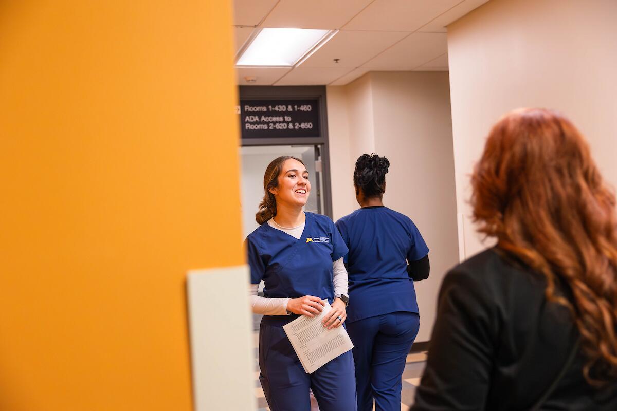 dental student gives a tour of moos tower to school of dentistry alumni