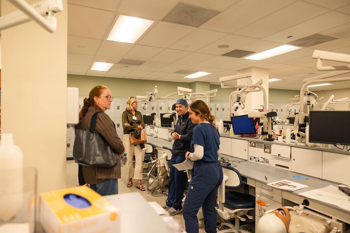 school of dentistry students give tour of pre-clinic space in moos tower
