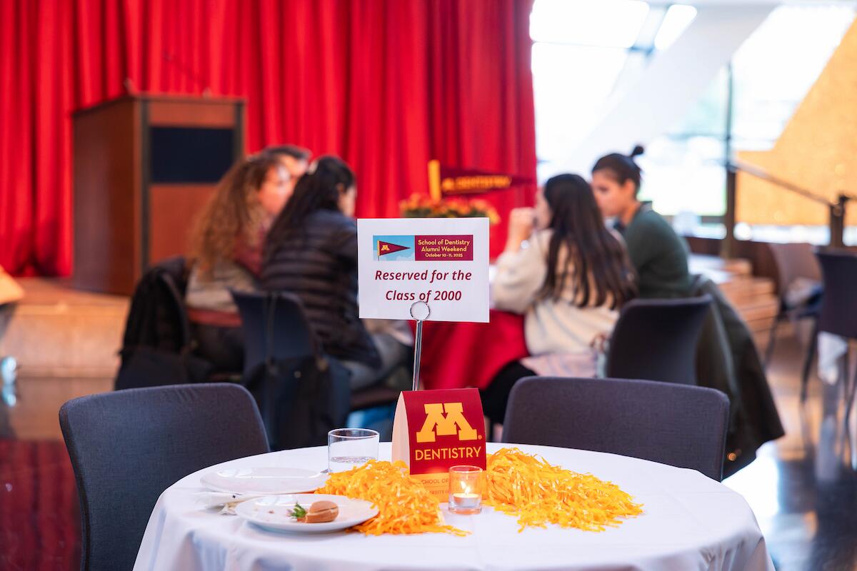 table at reception in mcnamara alumni center with sign that reads: "reserved for class of 2000"