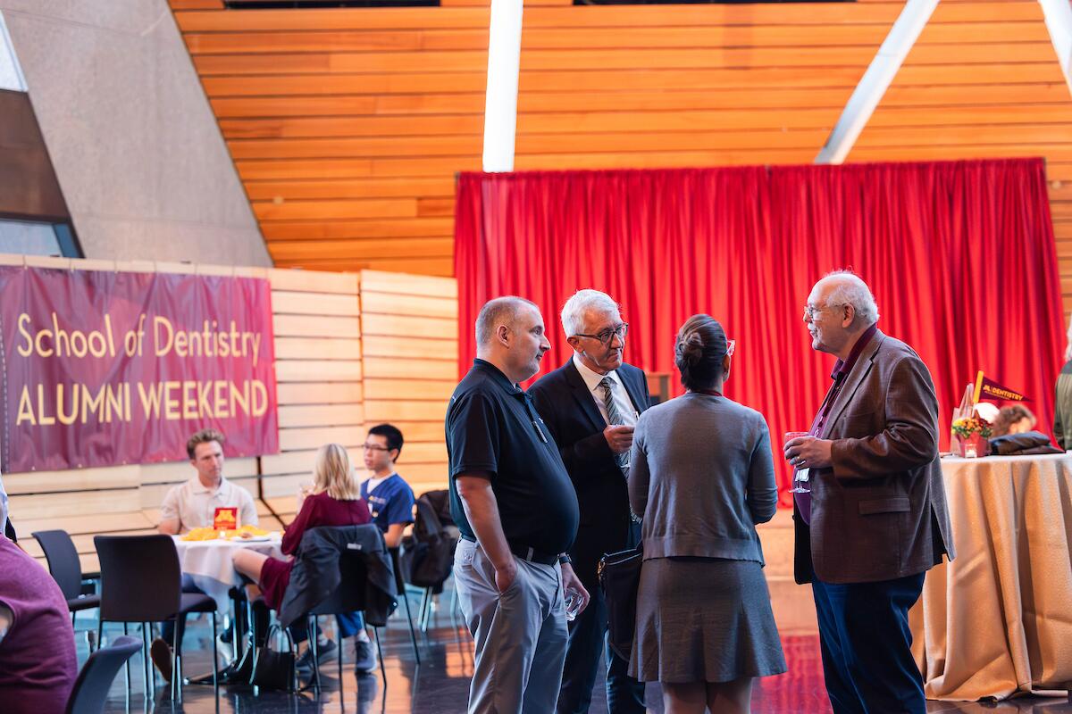 faculty chat at all school and alumni reception