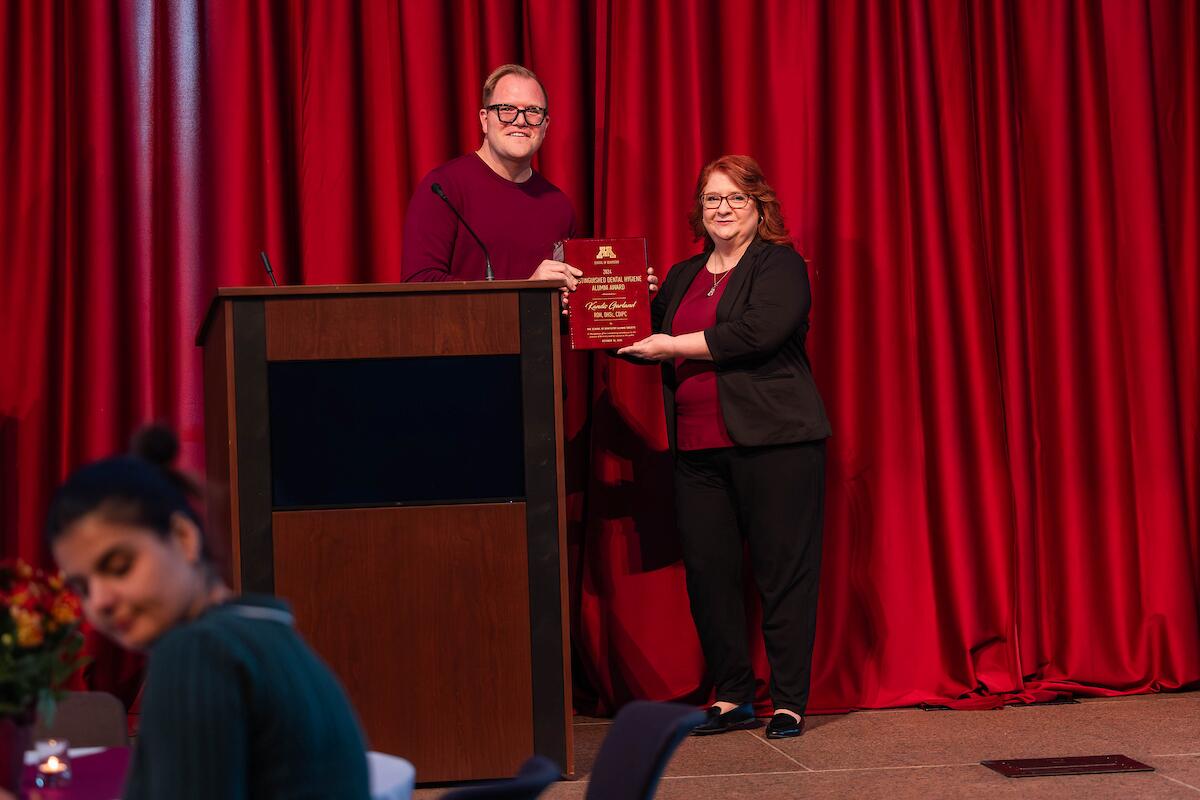 school of dentistry alumni accept awards