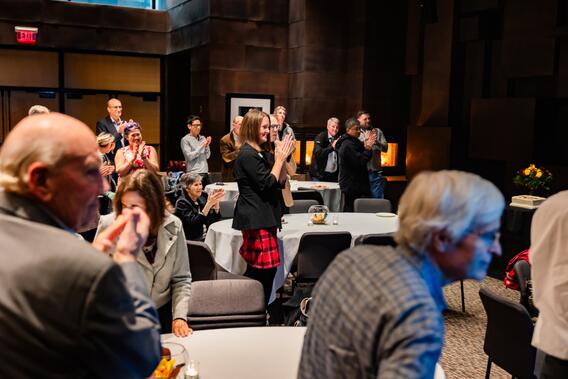 Attendees applaud Anderson