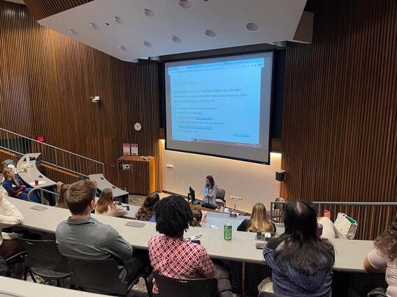 Attendees listen to a presentation by Susie Wold