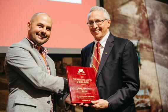 Gary Anderson accepting award.