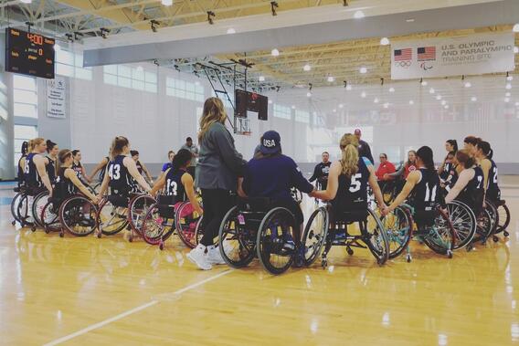 Group photo of Paralympic Wheelchair Basketball team holding hands