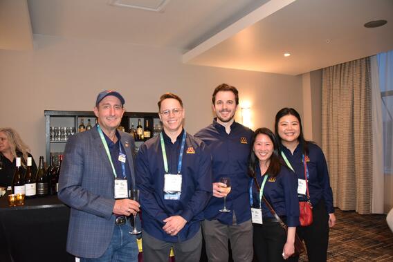 AAE attendees pose at a reception