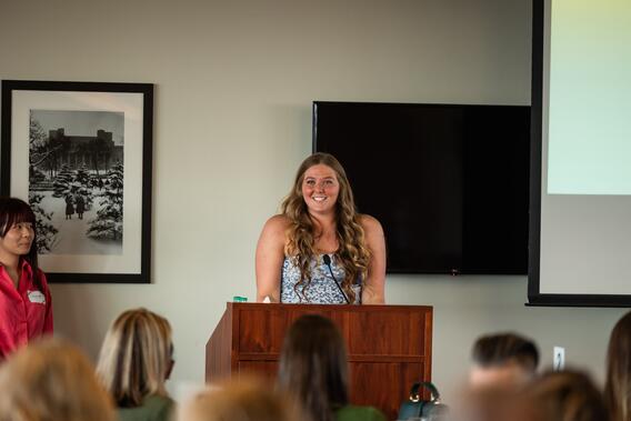 Monahan addresses the audience from behind a podium