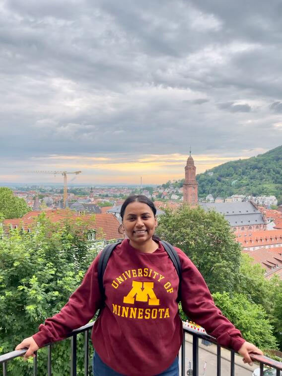 Preet Kanwal Dhaliwal poses atop a scenic vista in Heidelberg
