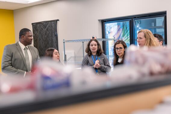 Brooks provides a tour of NorthPoint's food pantry