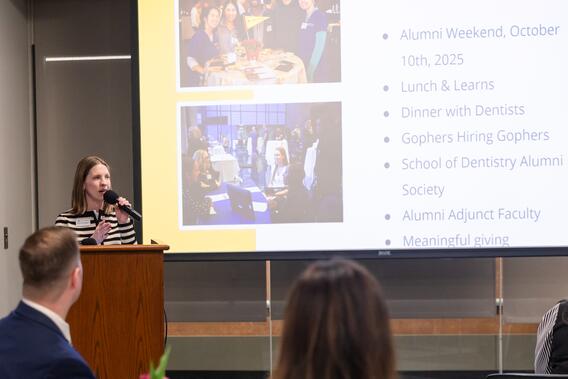 Noelle McComb Simonson speaks at a podium