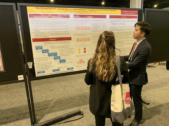 Justin Ho presents his poster at ADEA