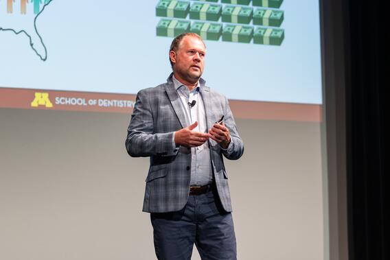 Donald Nixdorf presents onstage at Research Innovations