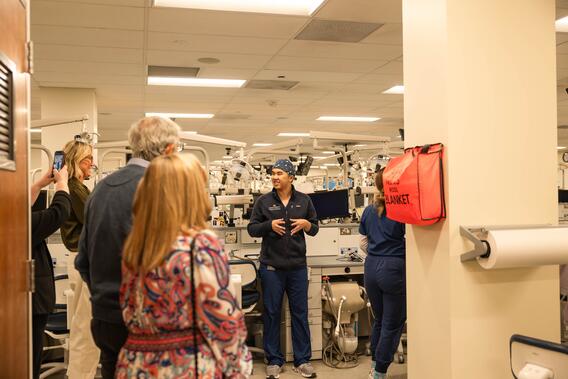 DDS students provide a tour of the preclinic to alumni weekend attendees