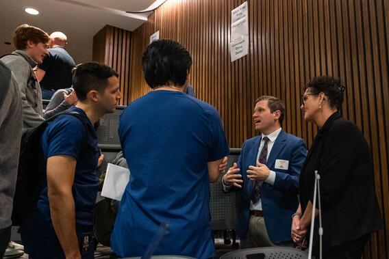 A School of Dentistry alumnus talks to current students during the Gophers Hiring Gophers job fair