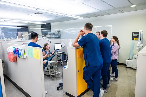 Students debrief with a standardized patient