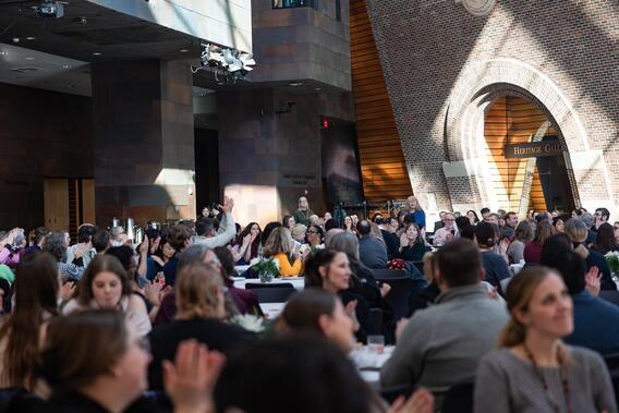 Attendees applaud service awardees at the winter celebration