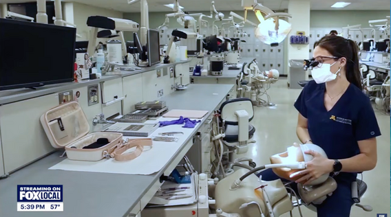Still from Fox 9 video depicts Beka Muhlenkamp working in the preclinic