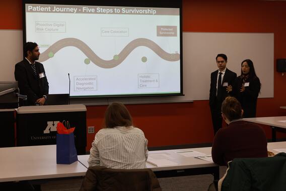 Kumar presents while his teammates look on at the CLARION competition
