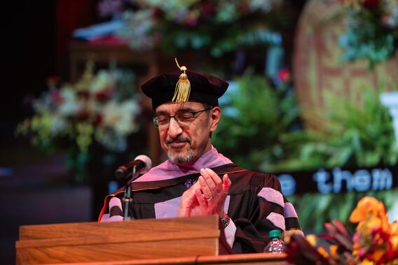 Nadershahi applauds and addresses the audience at commencement