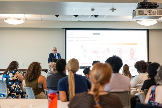 Kantarci speaks to the AADOCR Research Exchange audience