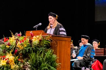Amber Cziok speaks at graduation