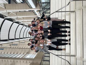 Students holding up M at ASDA conference.