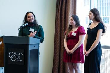 Pedro Lopez Vega speaks, while Kaitlyn Niemann and Danica Brannon stand next to him