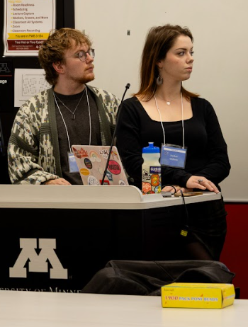 Skylar Birch and a fellow student present at the CHIP conference