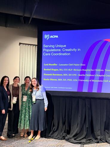 Olesen poses with her fellow panelists