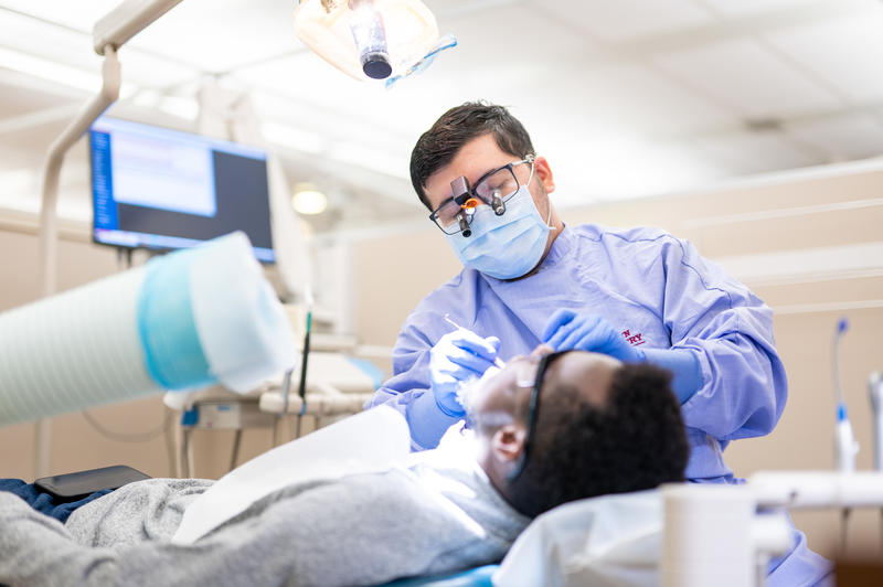 Resident cares for patient