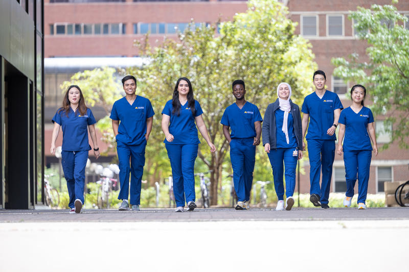 group of dental students walking outside