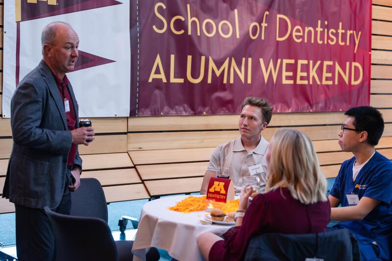 Students and alumni chat at Alumni Weekend