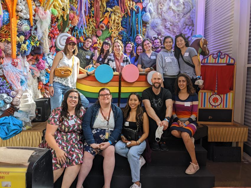 Advanced education learners and program coordinators pose at Can Can Wonderland