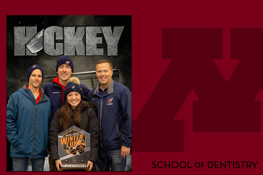 Kinsley Kehlenbeck with fellow coaches holding a trophy on a branded background