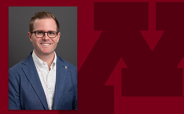 Headshot of Aaron Bumann on a branded background