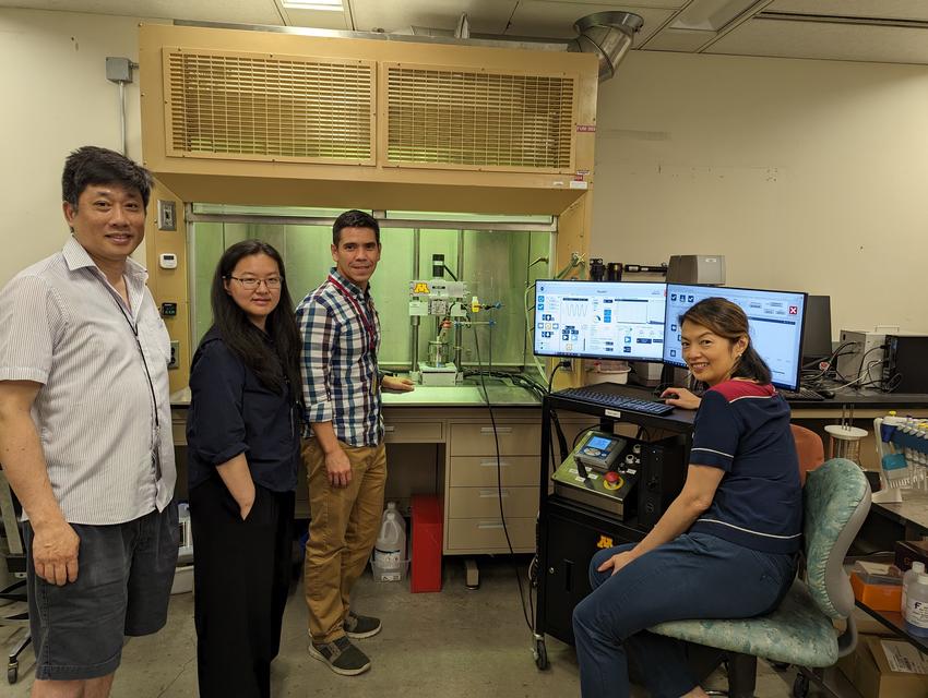 Fok, Zhang, Lima and Chew pose in their lab