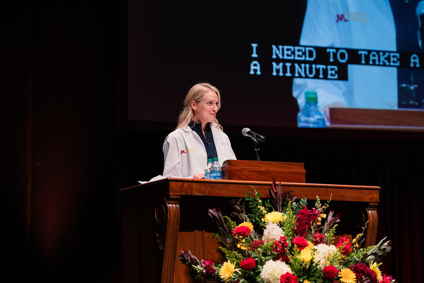 Janelle Jehn speaks at a podium