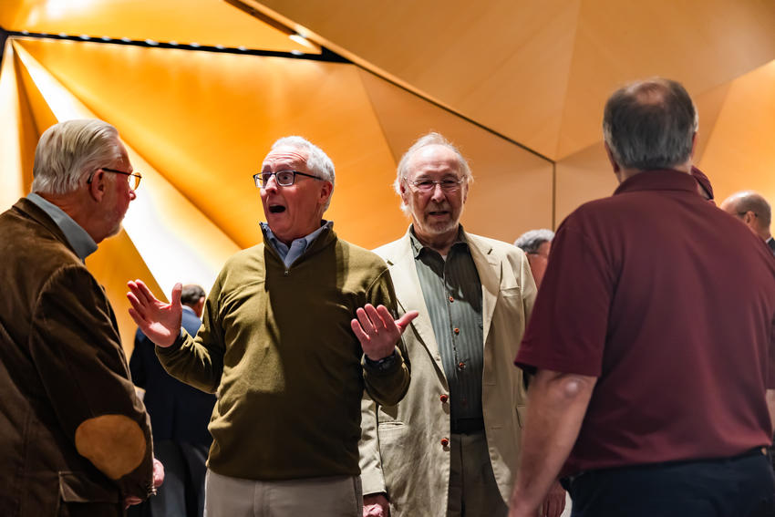 Gary Anderson speaks with other faculty members