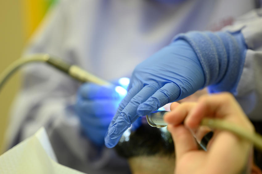 Close up of hands working.