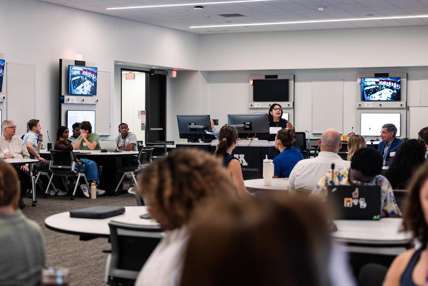 Participants listen to a talk during the summer research exchange