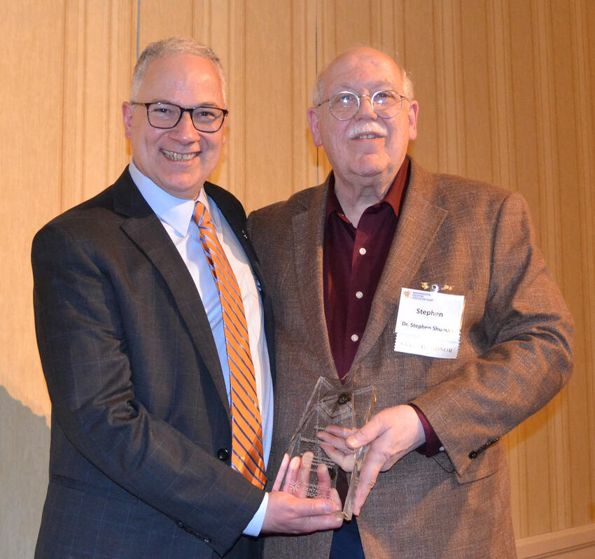 Shuman poses with his award and Carmelo Cinqueonce