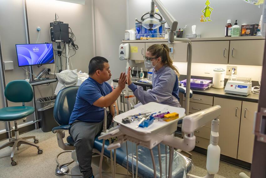 A patient and provider high five after treatment