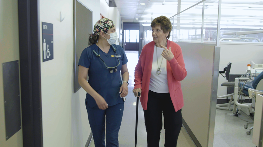 Jessie Walsh and Linda Marlin walk down the clinic hallway