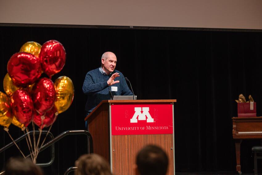 Costalonga addresses the audience at Research Day