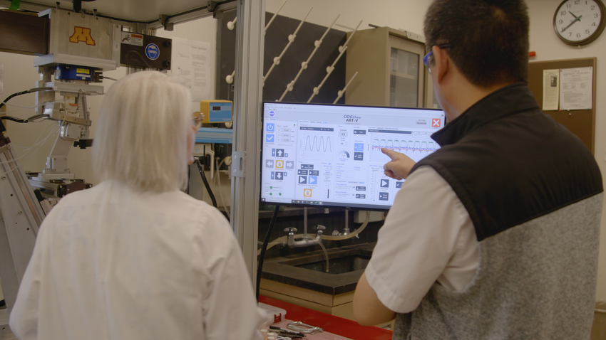 Alex Fok and Bonnie VanHeel watch the screen as the ART-5 works