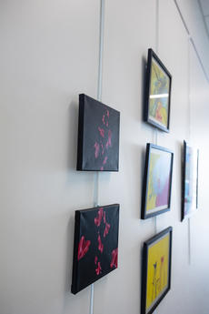 Side view of "suspended" alongside other works