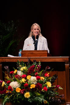 Janelle Jehn speaks at a podium