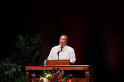 Karl Self, DDS, MBA, speaks at a podium