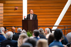 Karl Self, DDS, MBA, speaks at a podium