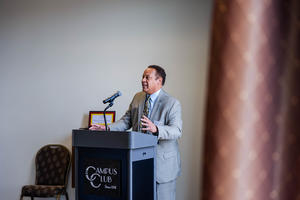 Karl Self, DDS, MBA, speaks at a podium